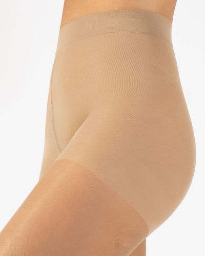 Cette Wellness Strong -kompressiosukkahousut 140 den 15-21 mm/hg - Beige Kompressiosukkahousut kevyesti hoitavalla 15-21 mmHg:n kompressiolla. CE-merkitty lääkinnällinen laite. S/36-38 - 2XL/52-54 475-117/BEI